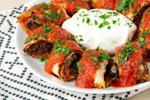 QR Menu Beyti kebab wrapped in lavash bread with yogurt and ezme