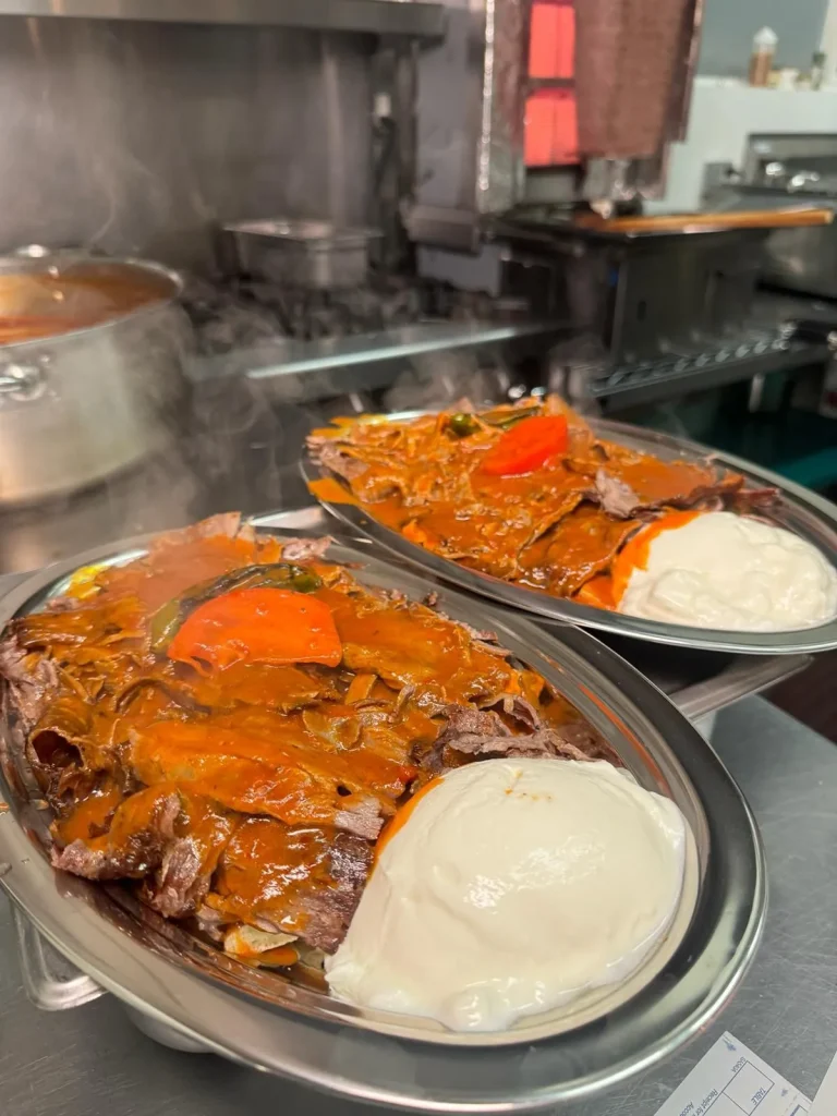 Beef Iskender kebab with pide bread, tomato sauce and yogurt