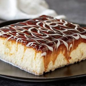 QR Menu Tres leches sponge cake topped with whipped cream and caramel