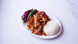 QR Menu Sliced chicken doner meat served over white rice with side salad.