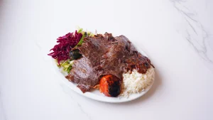 QR Menu Thinly sliced authentic Turkish beef doner served with white rice and red cabbage salad.