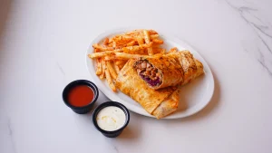 QR Menu Turkish beef doner wrap served with crispy french fries and dipping sauces.